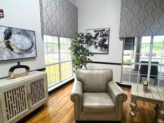 Cozy common area with comfortable seating and artwork