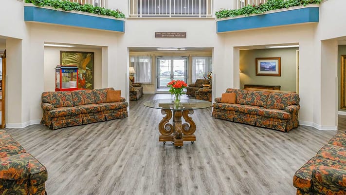 Bright common area with floral decorations and seating
