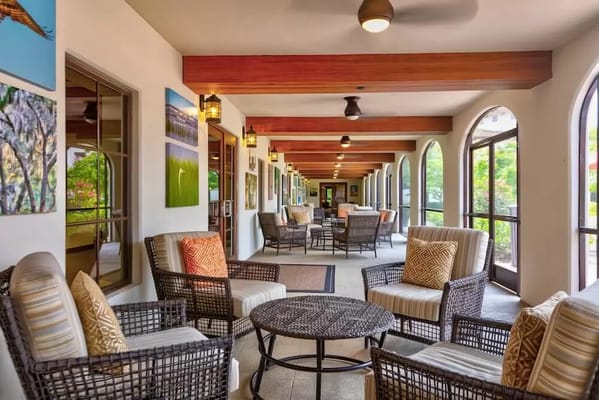 Common area with seating and artwork on the walls