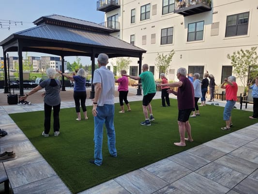 Residents participating in an outdoor exercise class