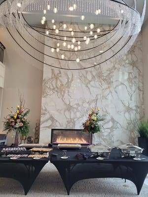 Elegant foyer with floral arrangements and a buffet table