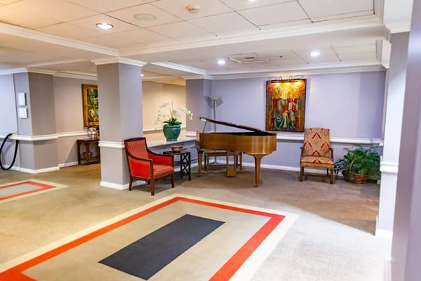 Cozy lobby with piano and seating area