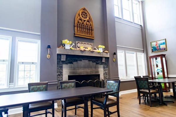 Interior view of a common area with a fireplace and seating