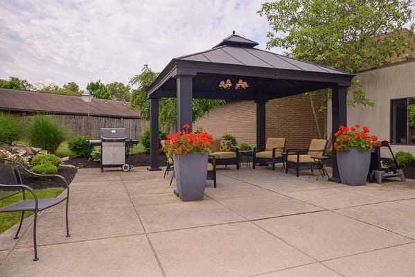 Outdoor seating area with gazebo and flowers