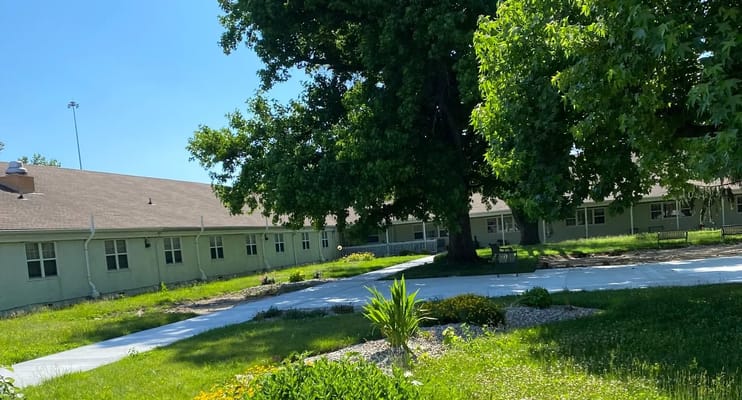 Outdoor view of a nursing facility with gardens