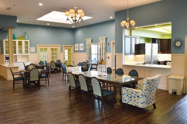 Bright and spacious dining area with tables and chairs