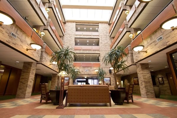 Spacious lobby area with seating and plants