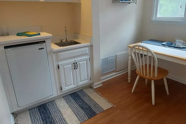 A cozy kitchenette area in a resident room