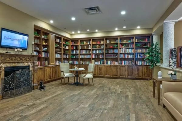 Cozy library area with bookshelves and seating