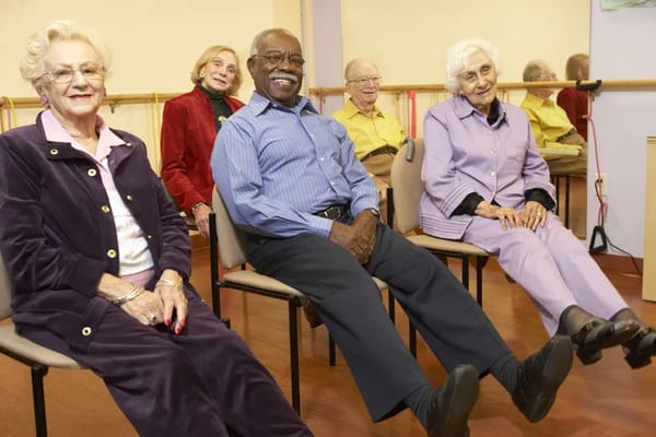 Residents participating in a seated activity session