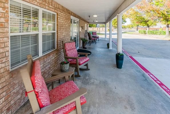 Outdoor seating area with rocking chairs