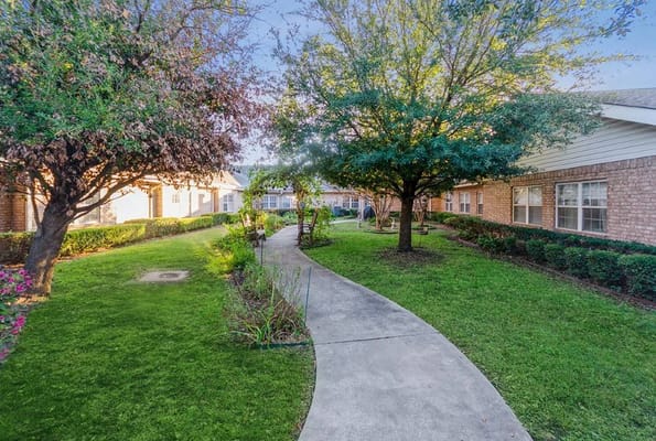 Well-kept garden pathway in an assisted living facility