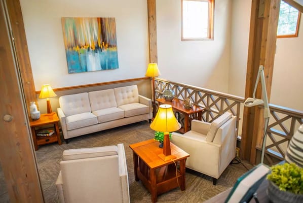 Cozy lounge area with sofas and lamps