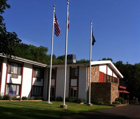 Exterior view of the nursing facility with flags