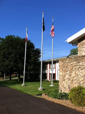 Exterior view of the facility with flags