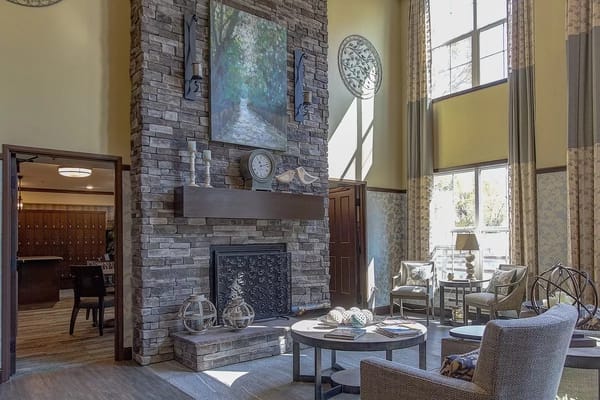 Cozy lobby with stone fireplace and seating area