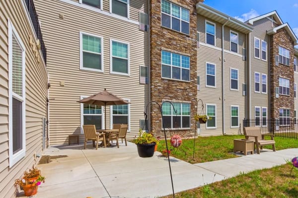 Outdoor patio with seating and an umbrella