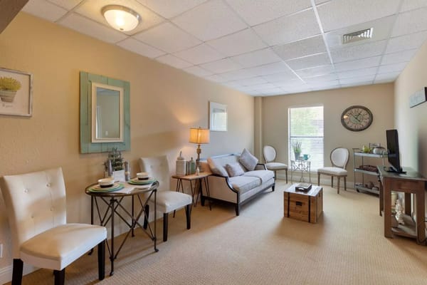 A cozy interior living room setting with furniture