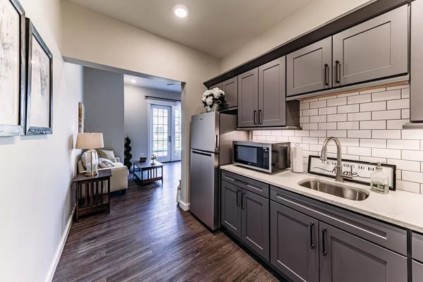 Brightly lit kitchenette in a senior living apartment