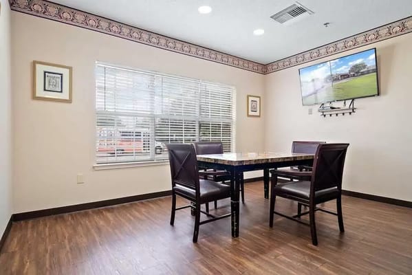 Interior common area with a table and chairs
