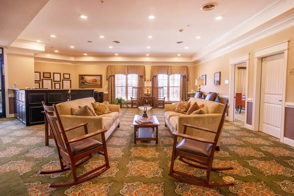 Comfortable living room with sofas and rocking chairs