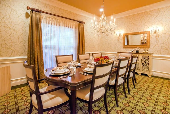 A beautifully set dining table in an elegant dining room.