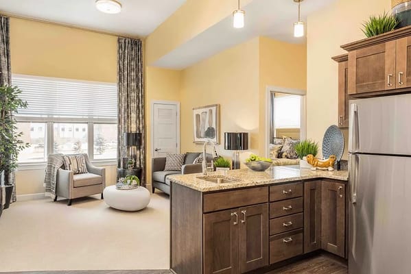 Bright interior view of a living area with kitchen