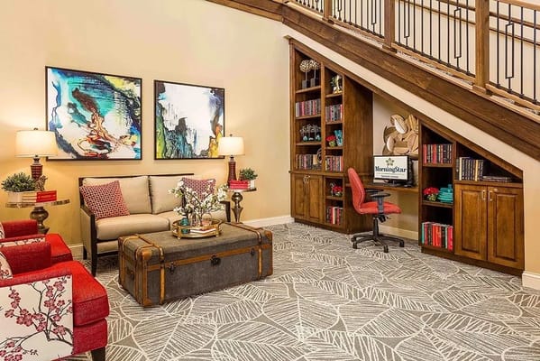 Bright common area with seating and artwork