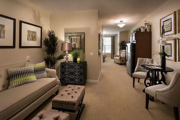 Bright and inviting living area with sofa and dining table in MorningStar Assisted Living.