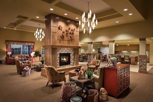 Spacious lobby area with a fireplace and seating