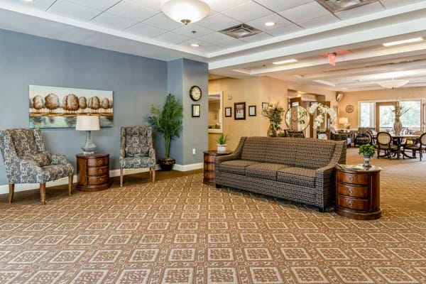 Cozy lounge area with seating and decorative artwork