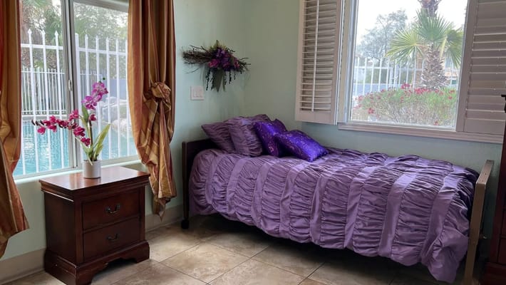 Comfortable resident room with bed and window view