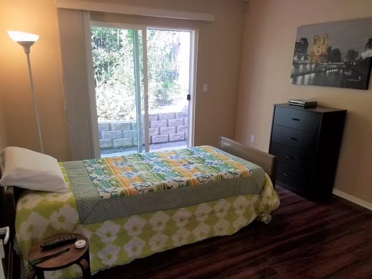 Cozy private room with a bed and dresser
