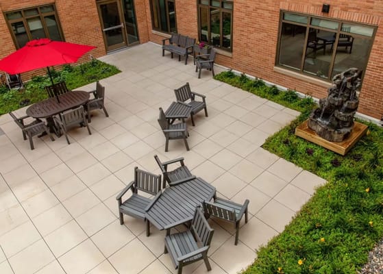 Outdoor seating area with chairs and umbrella
