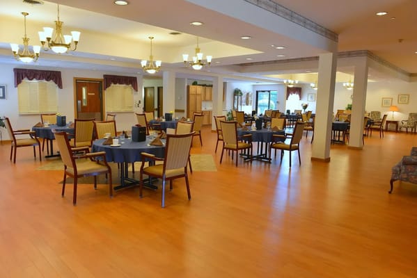 Dining room with tables set for residents