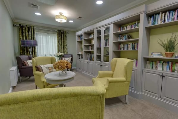 Cozy common area with seating and bookshelves