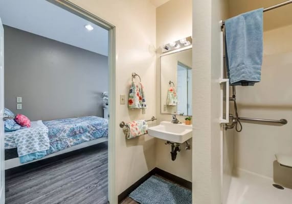 Interior view of a resident's room with bathroom