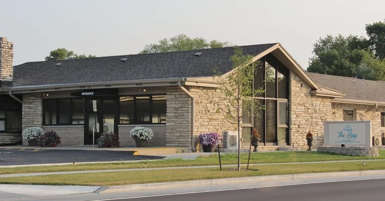 Exterior view of the facility entrance with landscaping