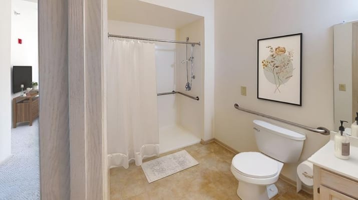 Bright bathroom with shower and accessible features
