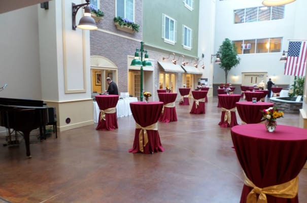 Common area set up for a celebration with tables and decorations