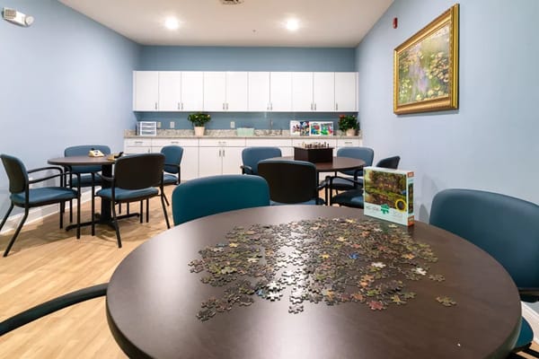 Activity room with puzzle pieces on a table