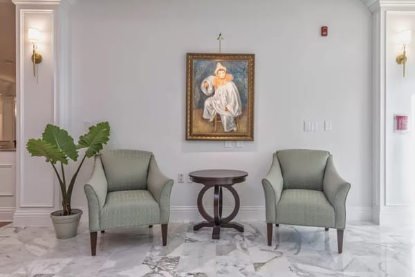 Interior space with armchairs and artwork