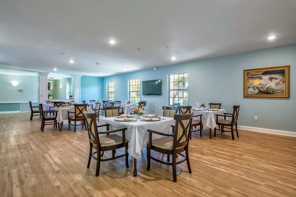 Bright dining room with tables set for meals
