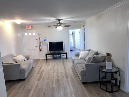 Cozy common area with seating and a television