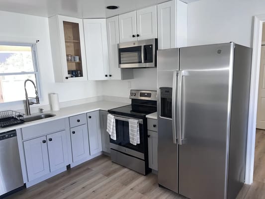 A bright, modern kitchen with stainless steel appliances
