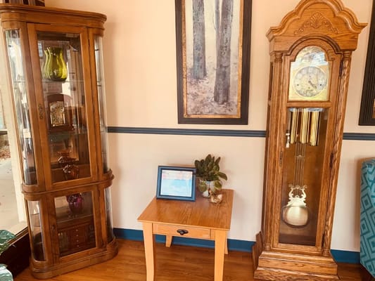 Interior decor with an ornate clock and display cabinet