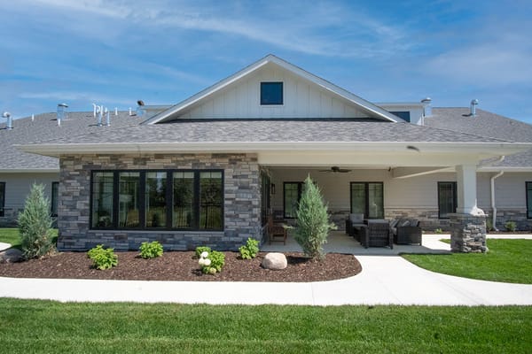 Exterior view of a senior living facility with landscaping