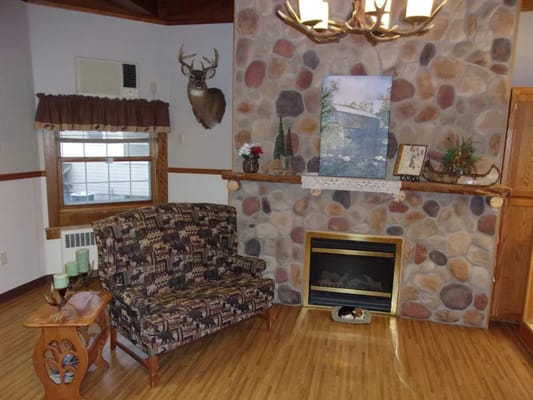 Cozy common area with a stone fireplace