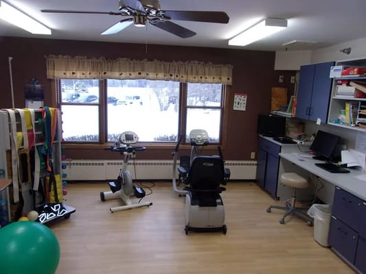Interior view of a rehabilitation therapy room with equipment