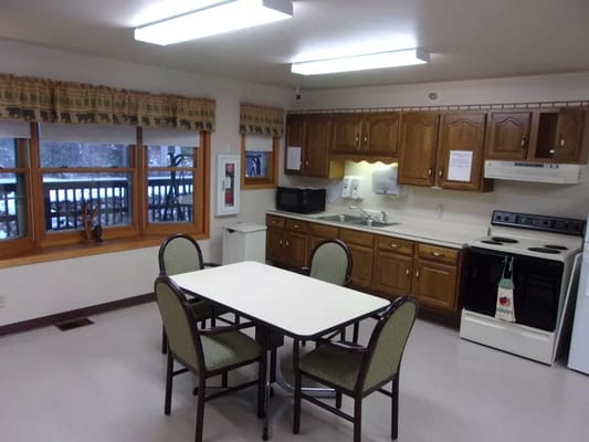 A bright kitchen area with a table and chairs